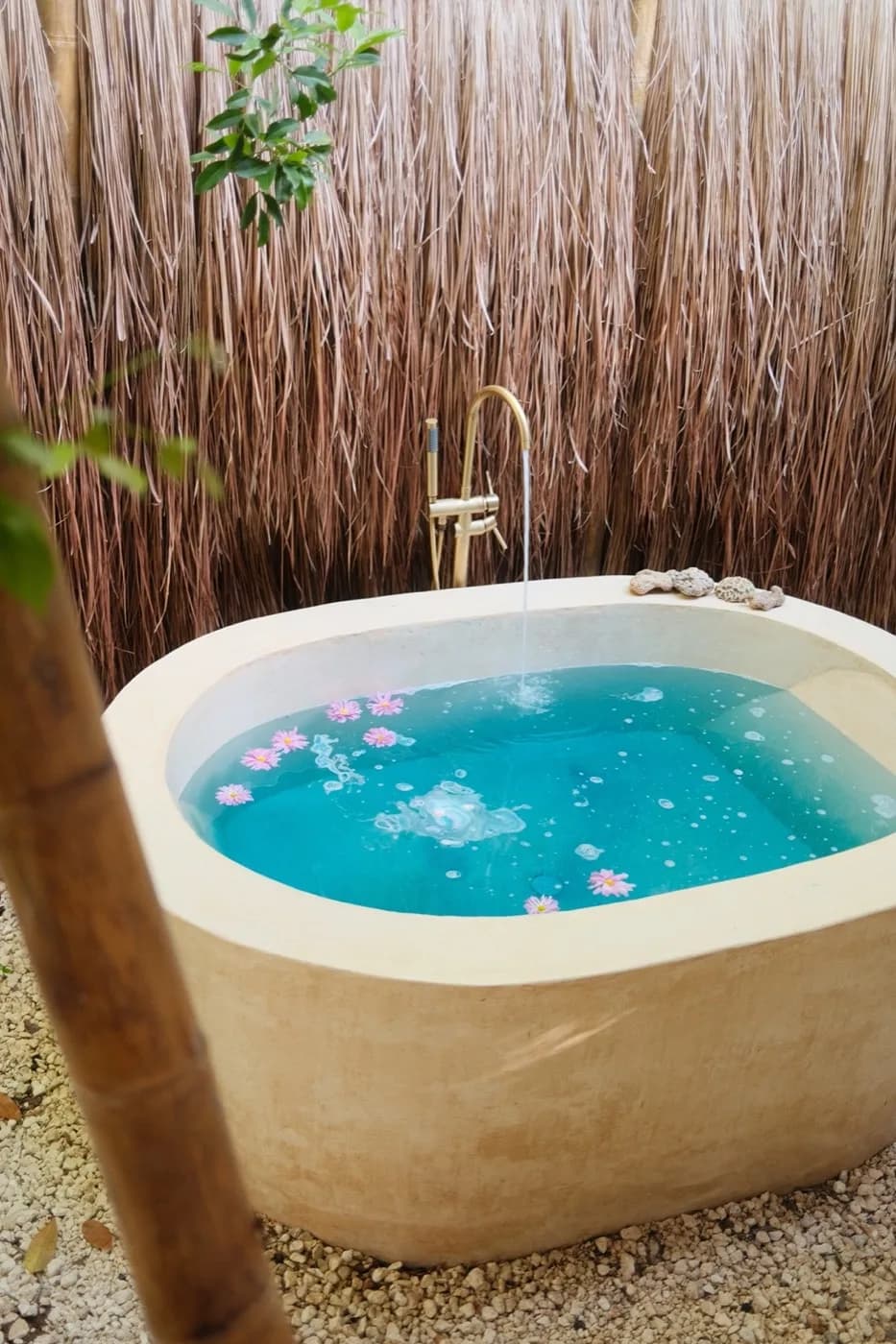 Outdoor stone tub at Mauna Tulum at dusk